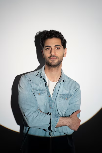 An actor headshot of guy posing in a creative manner for his portfolio