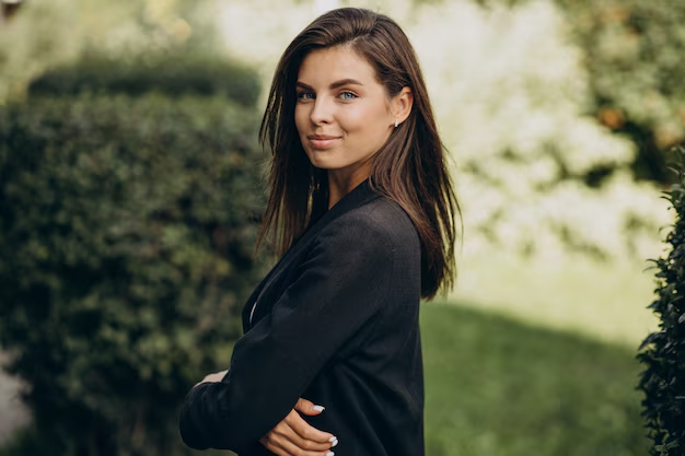 A woman showing her side profile for a professional outdoor headshot