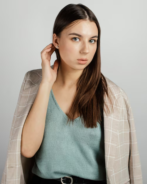 A model posing for her professional modeling headshots in an engaging pose