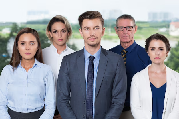 An example headshot of team headshot shot outdoors with people dressed in a formal attire