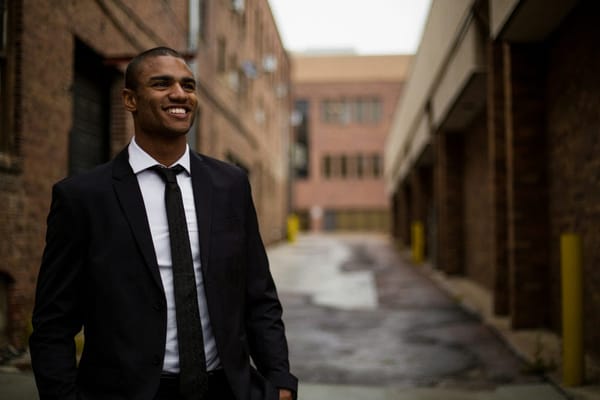 7 times you should invest in your professional headshots: Here's a picture of a man dressed in a neat suit